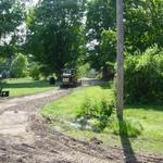 BEFORE picture of Mike's gravel driveway in Cedar Springs, had drainage issues and clay base.  Ready for the Gravel Paving with Crushed Asphalt.