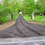 Repaired the drainage on the approach of this gravel driveway.  Installed a top layer of crushed asphalt.  This driveway is located in Twin Lake just north of the Muskegon River.