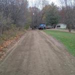Photo of Lori's driveway, long slope repaired with crushed concrete. www.gravelgraders.com