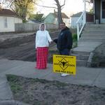 Steven and his wife Penny in front of their new crushed asphalt/crushed blacktop driveway!  www.gravelgraders.com